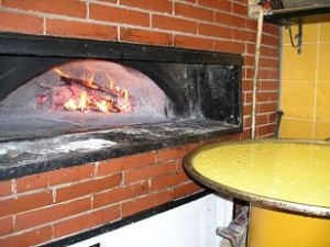 Forno a legna e oro in teglia